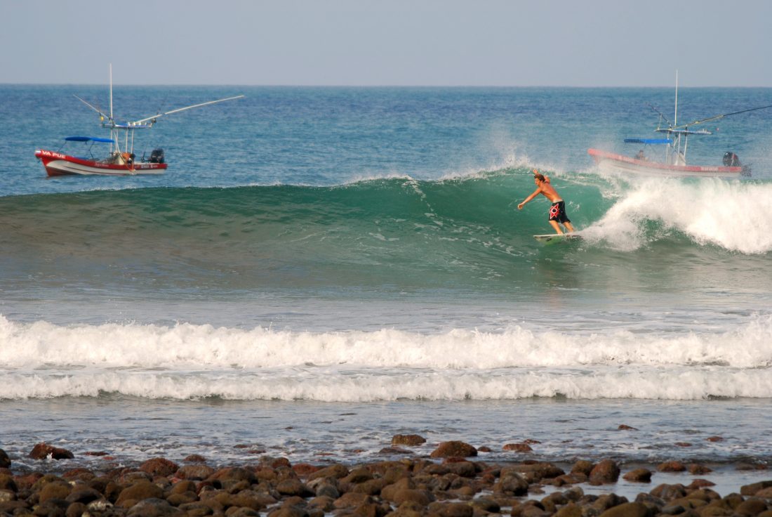 A surfer takes off on a playful right at Playa Playgrounds in Nicaragua